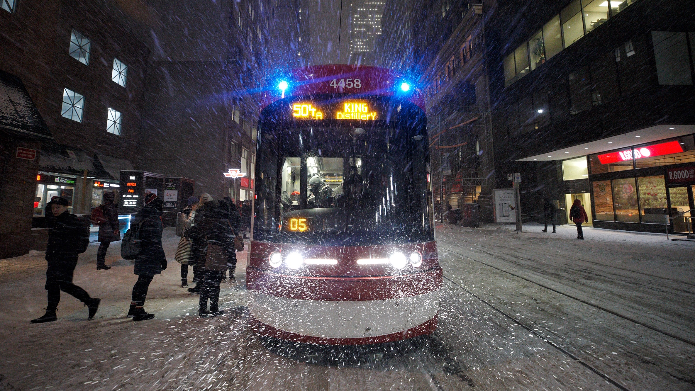 A TTC 504 King streetcar makes its way through downtown Toronto Monday evening.