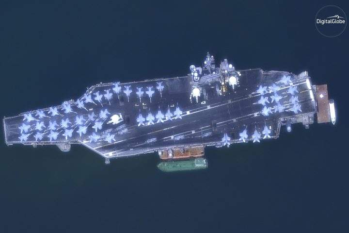 This March 6, 2018 satellite image provided by DigitalGlobe shows The USS Carl Vinson off the coast of Danang, Vietnam.