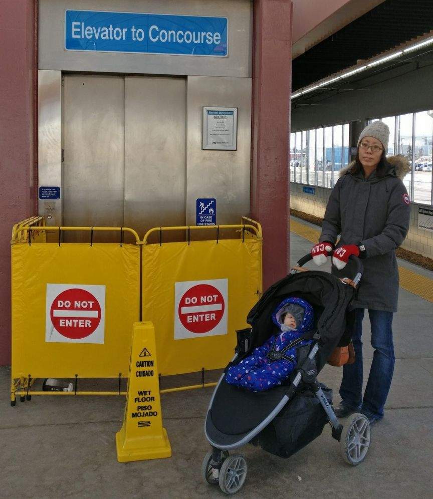 Sharon Yeo with her daughter and stroller in front of the closed elevator at the Stadium LRT station near downtown Edmonton, Alta. on Tuesday, January 29, 2019.