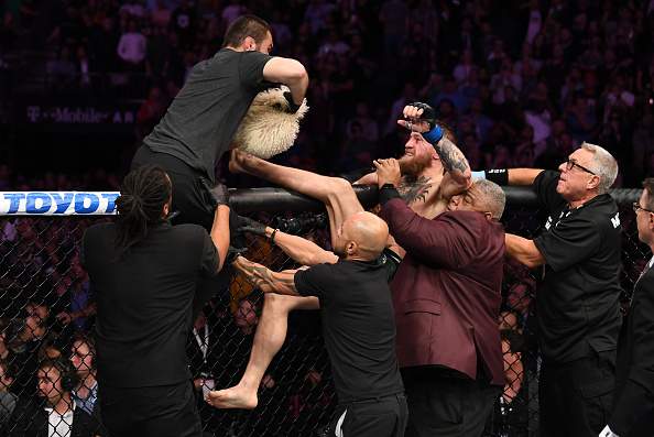 Conor McGregor of Ireland is involved in a post-fight incident following his loss to Khabib Nurmagomedov of Russia in their UFC lightweight championship bout during the UFC 229 event inside T-Mobile Arena on October 6, 2018 in Las Vegas, Nevada.