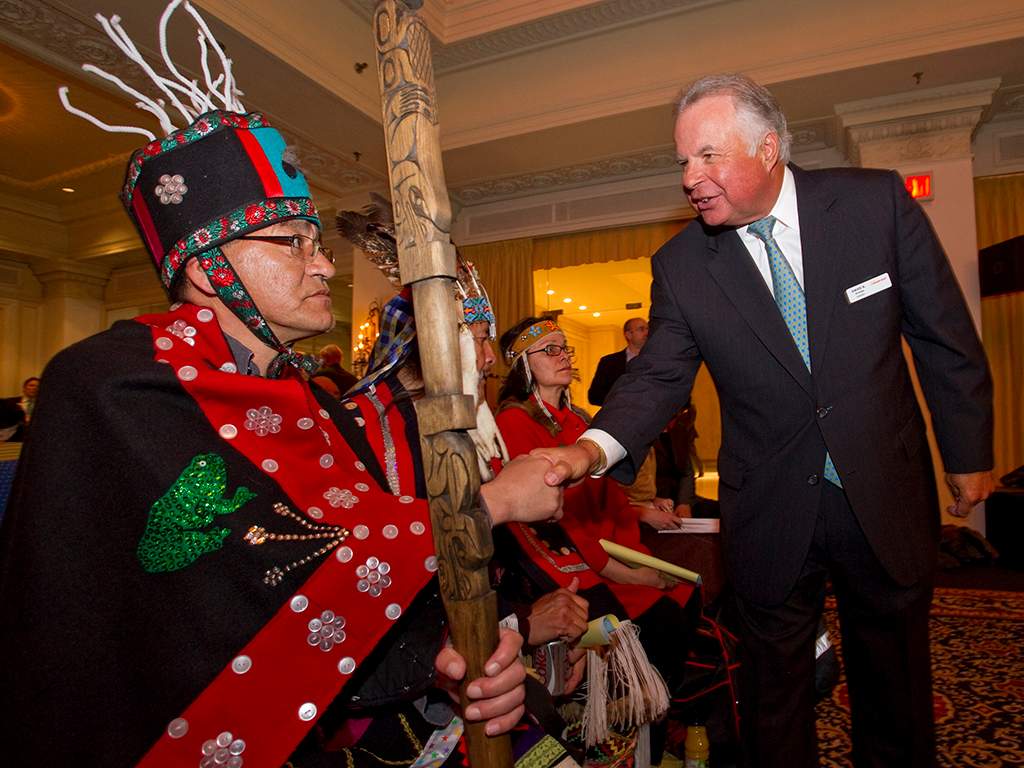 Chair of the Board, David Arledge (R) greets Hereditary Chief Na’Moks, of Tsayu Clan, Wet’suwet’en band at the King Edward Hotel in Toronto.