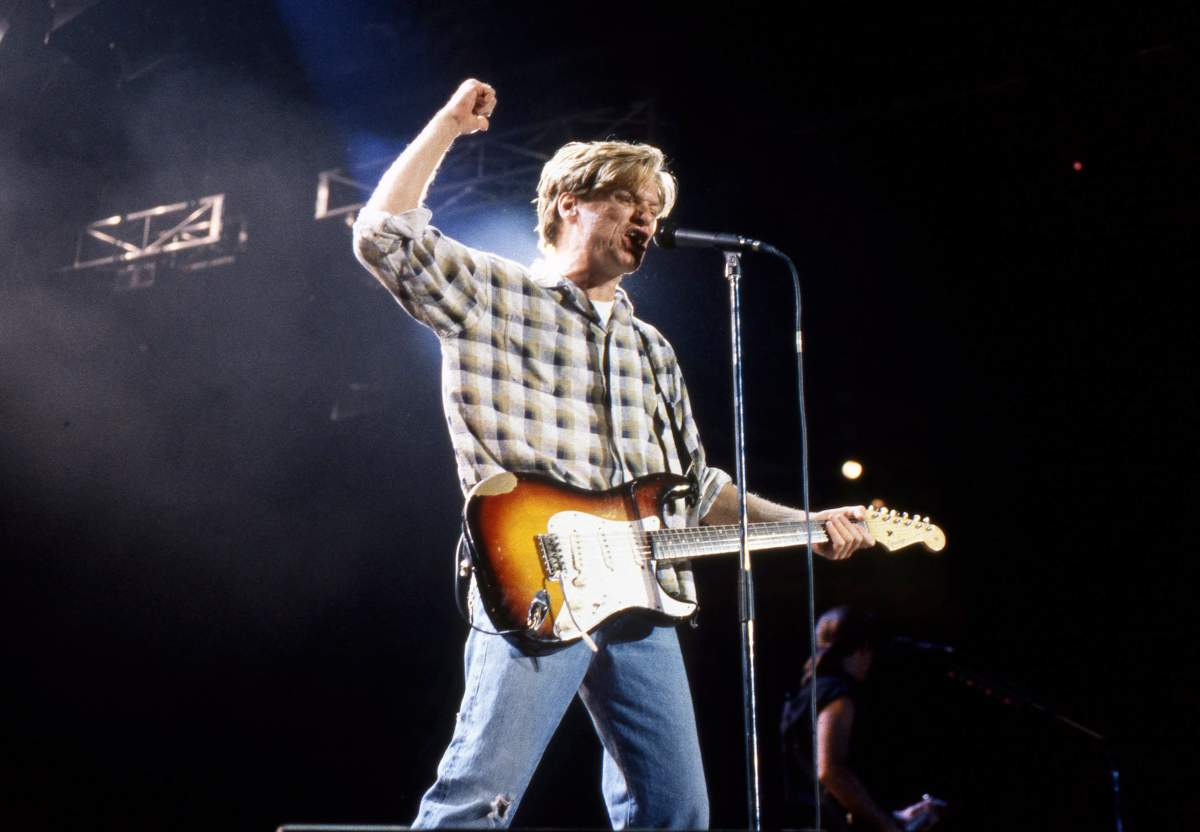 Bryan Adams performs on stage in Ireland, 1990.
