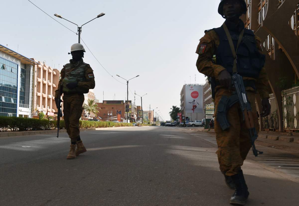 FILE -- Burkina Faso gendarmes patrol outside the Splendid hotel and the Cappuccino restaurant following a jihadist attack in Ouagadougou on January 16, 2016.