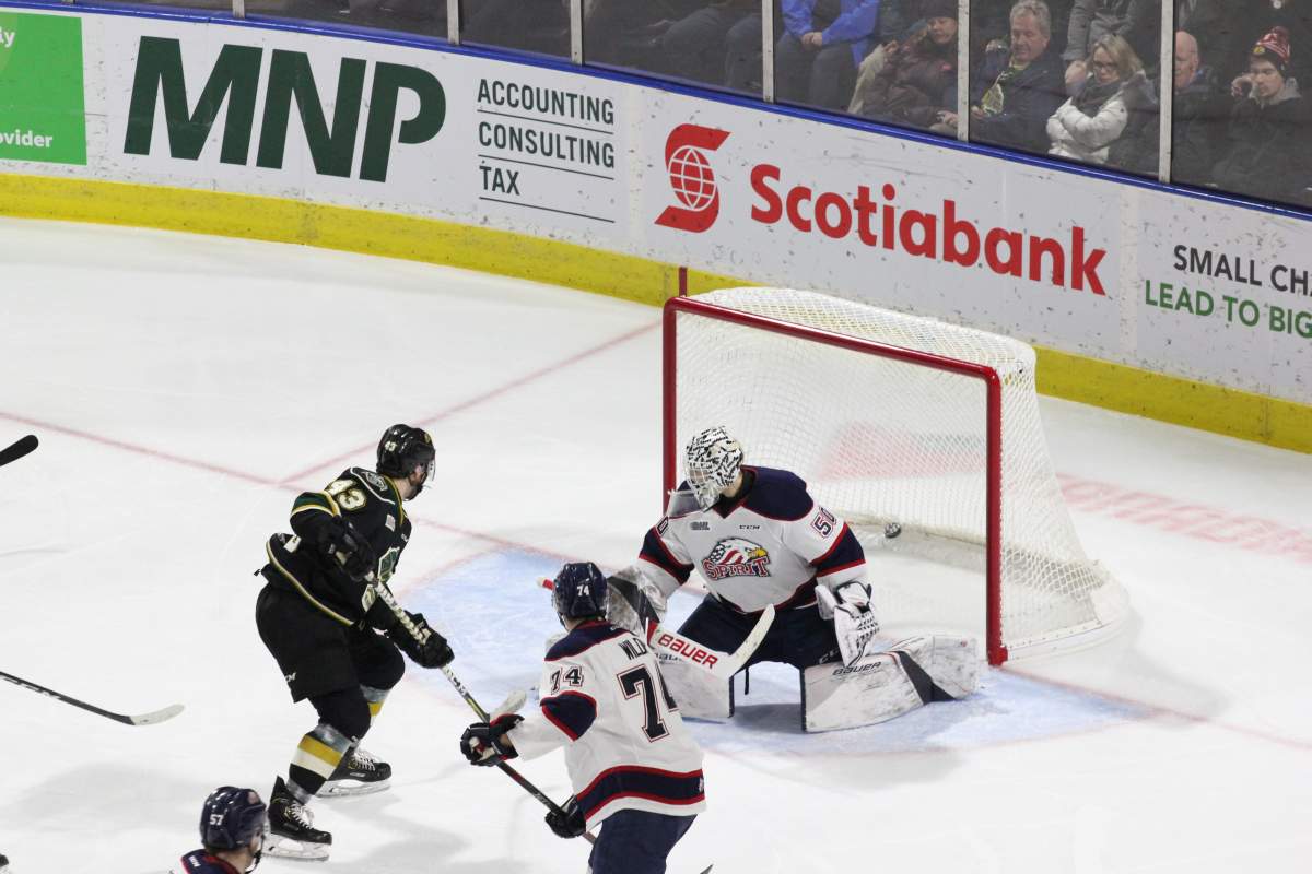 London, Ont. - London Knights forward Paul Cotter deflects a puck past Saginaw goaltender Ivan Prosvetov in a 4-1 London win on January 11, 2019.