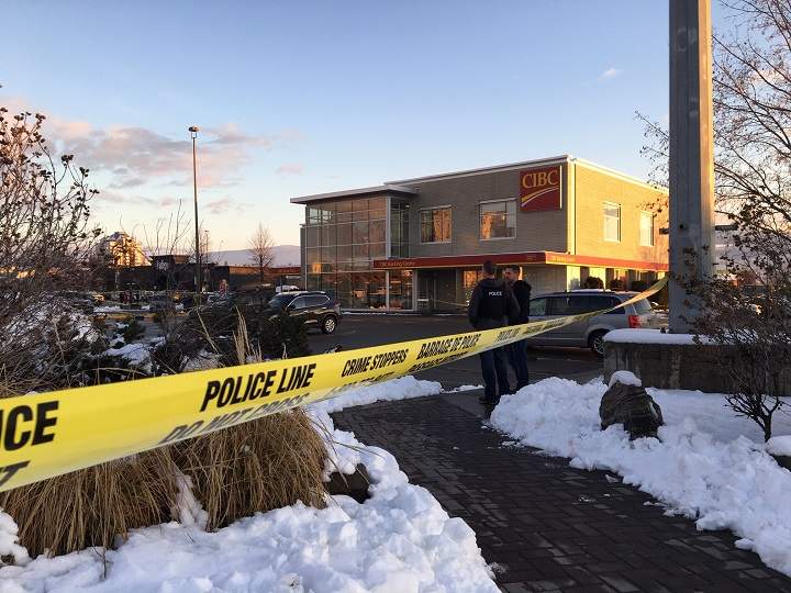 Yellow tape and police members can be seen outside the CIBC branch in Kelowna on Wednesday afternoon.
