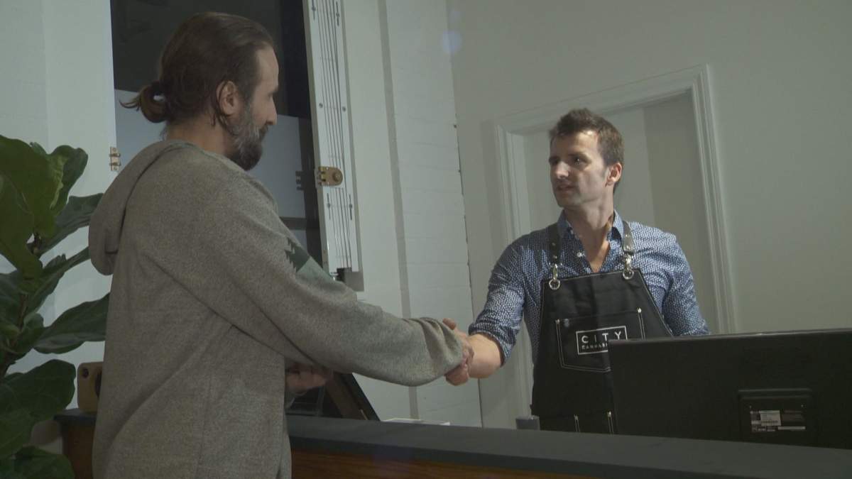 Krystian Wetulani with City Cannabis Co. makes his first ever legal sale after getting provincial and municipal licences to open.