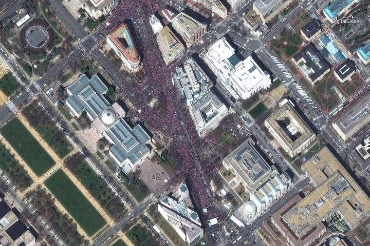 This March 24, 2018 satellite image provided by DigitalGlobe shows crowds at the “March for Our Lives” demonstration in Washington.