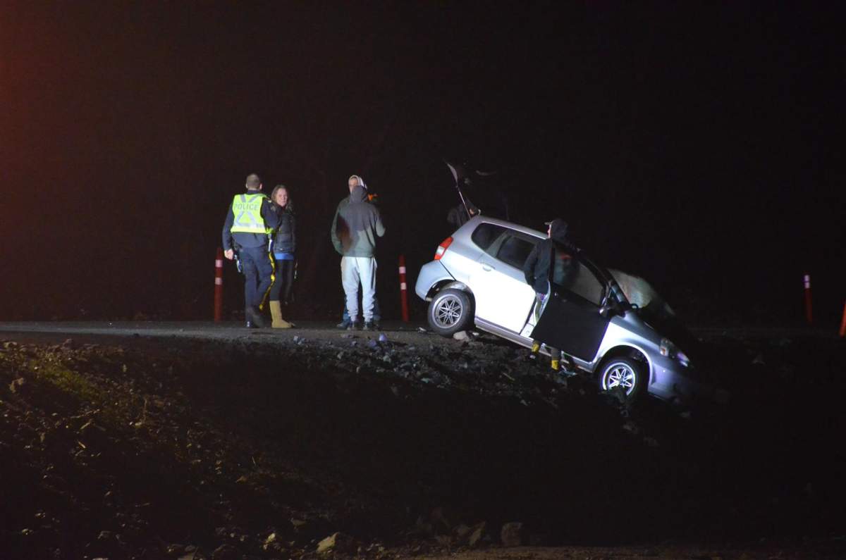 Two of the three vehicles had collided head-on and one flipped onto its side, officials said.