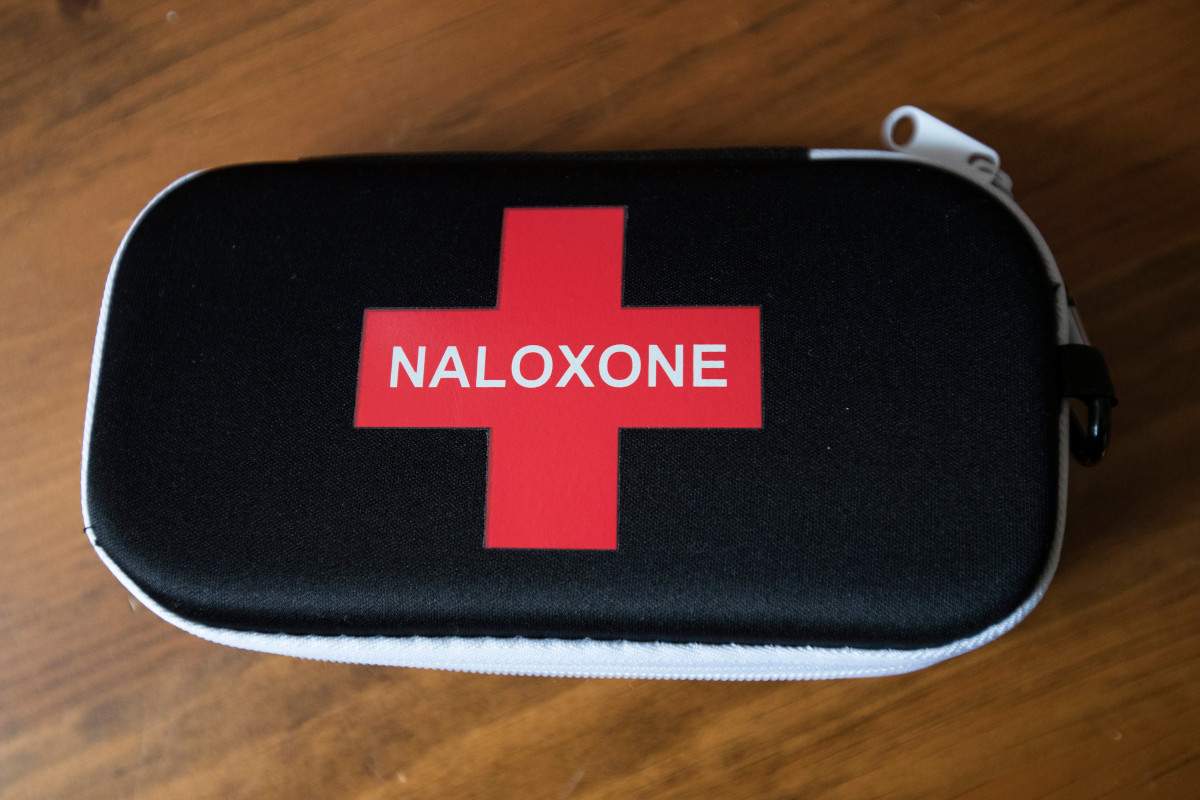 Police say a quick-thinking passerby who saw the woman used naloxone to save her life.