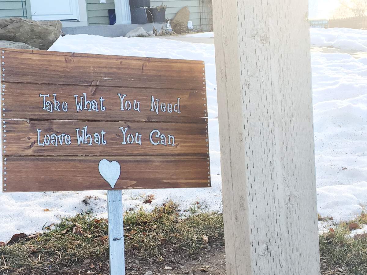 She posted a sign inviting people to “take what they need and leave what they can.”