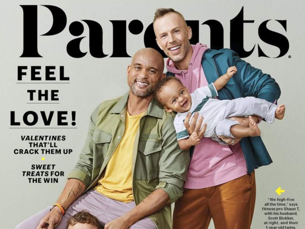 Fitness trainer Shaun T and husband Scott Blokker on the cover of Parents magazine with their two sons. 