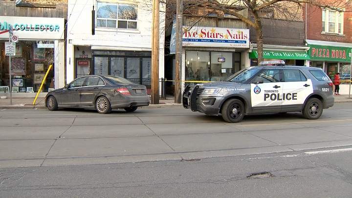 Toronto police on scene of a double shooting near Queen Street and Woodbine Avenue on Sunday afternoon.