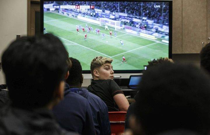 Students at St. Nicholas Catholic Junior High School watch the FC Bayern Munich vs TSG 1899 Hoffenheim on tv in Edmonton, Alta., on Friday January 18, 2019. Former Nicholas Catholic Junior High student, Alphonso Davies joined Bayern Munich in the new year, following a $22-million transfer from the Vancouver Whitecaps.