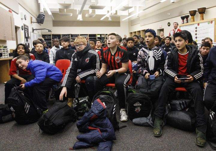 Students at St. Nicholas Catholic Junior High School watch the FC Bayern Munich vs TSG 1899 Hoffenheim on tv in Edmonton, Alta., on Friday January 18, 2019. Former Nicholas Catholic Junior High student, Alphonso Davies joined Bayern Munich in the new year, following a $22-million transfer from the Vancouver Whitecaps.