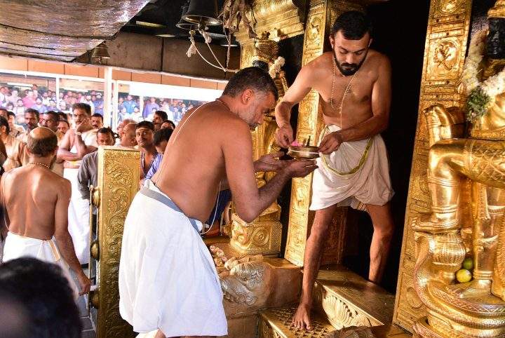 Indian priests perform rituals inside the Sabarimala temple in Kerala, India 02 January 2019.