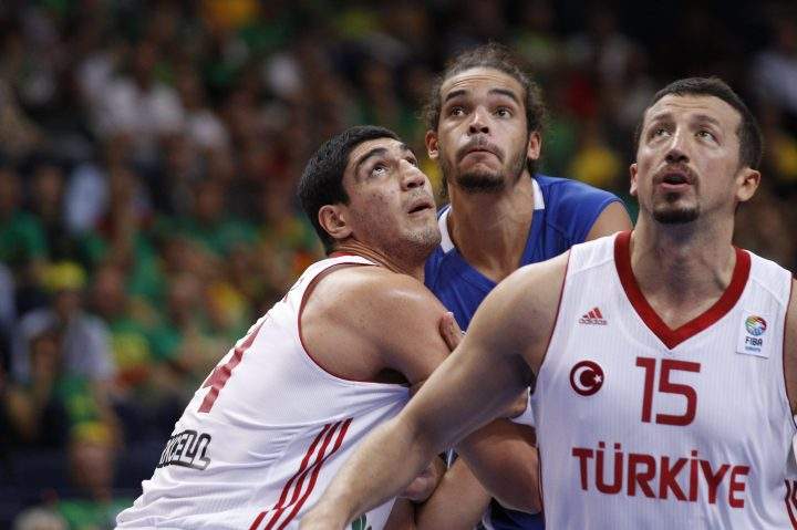 Hidayet Turkoglu, right, and Enes Kanter, left, of Turkey is challenged by Joakim Noah, from France during the EuroBasket 2011 in Vilnius, Lithuania, on Wednesday, Sept. 7, 2011.
