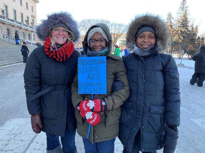 Debra Danco, Ruvimbo Chimutsa and Wara Chiyoka (from left to right) stand outside the Manitoba Legislative building for the Winnipeg Women’s March.