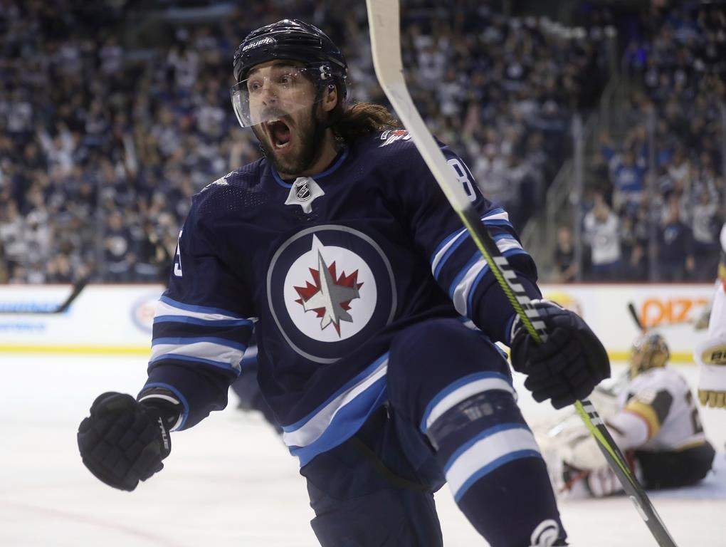 Winnipeg Jets' Mathieu Perreault (85) celebrates after scoring on Vegas Golden Knights goaltender Marc-Andre Fleury (29) during second period NHL hockey action in Winnipeg, Tuesday, January 15, 2019.