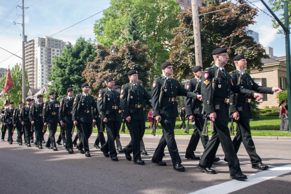 Active and veteran members of the Canadian Army’s 1st Hussars parade through London, Ont., on June 1, 2014, to commerate the 70th Anniversary of D-Day. The 1st Hussars landed on Juno Beach in Normandy France as part of operation Overload.