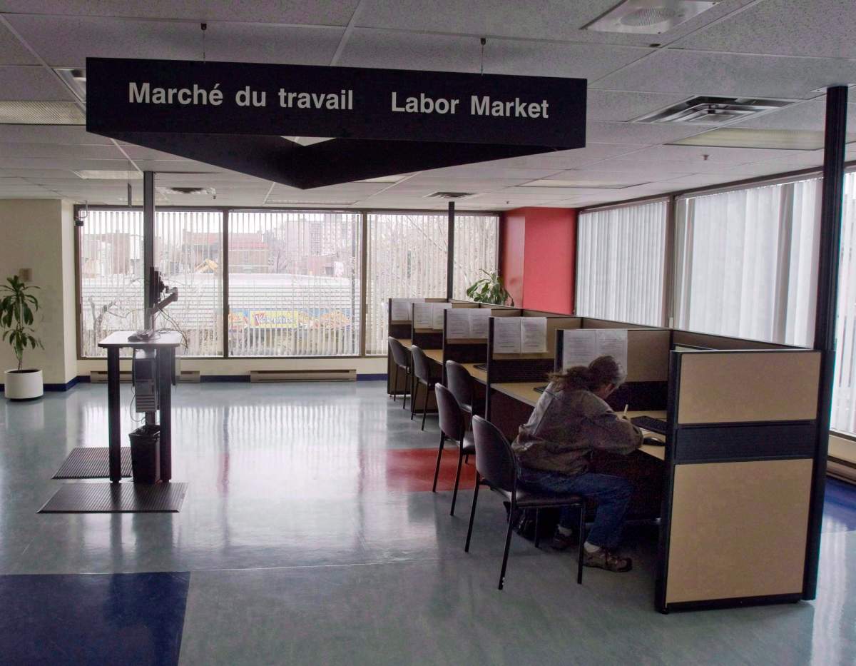 A man looks through jobs at a Resource Canada offices in Montreal April 9, 2009. 