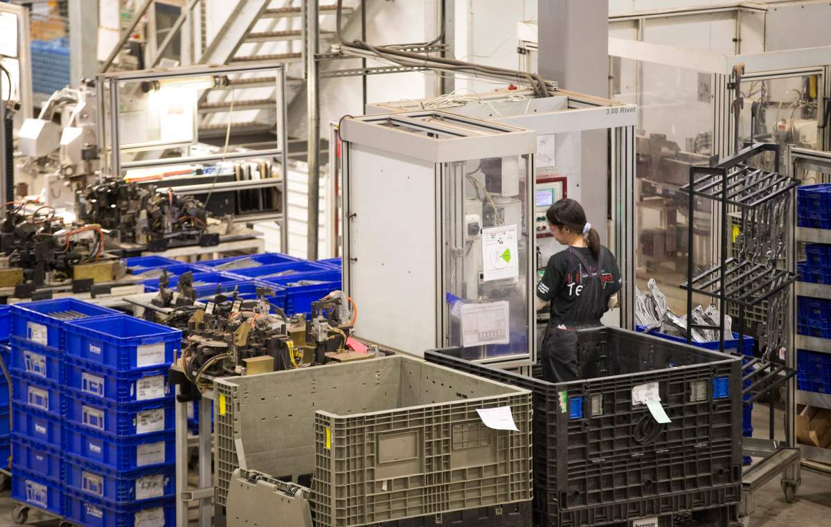 An employee is seen at the Brose Canada plant in London, Ontario, Thursday, February 27, 2014.