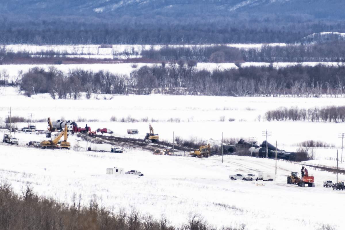 Excavators work at the site of a train derailment ten-kilometres south of St. Lazare, Man. on Saturday February 16, 2019. A train carrying oil has derailed and is leaking in western Manitoba. Canadian National Railway says in a statement that 37 cars carrying crude left the tracks early Saturday morning near St-Lazare, just east of the Saskatchewan-Manitoba boundary.