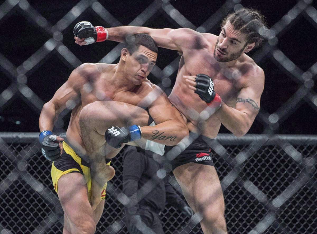 Elias Theodorou, right, of Mississauga, Ont., battles Cezar Ferreira, of Brazil, in middleweight UFC Fight Night action, in Halifax on Sunday, Feb. 19, 2017. 