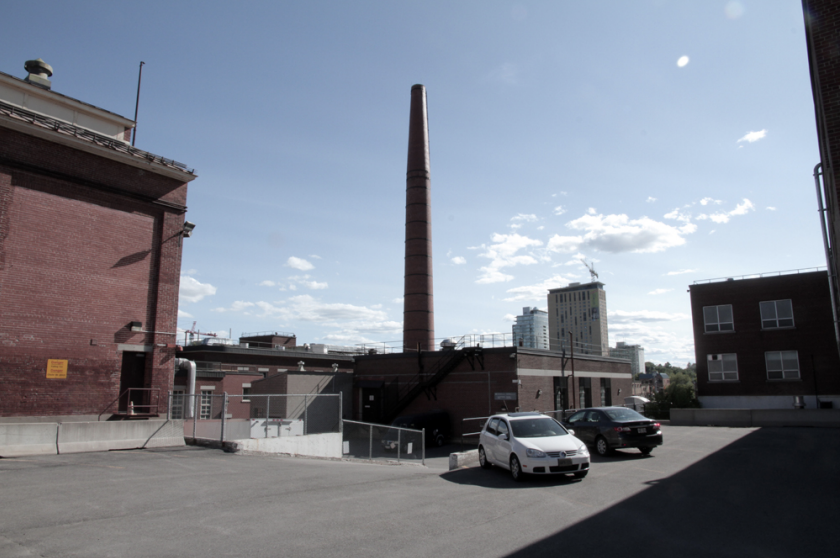 An image of the central heating plant and attached smokestack at 558 Booth St. In recommending the Booth Street Complex receive heritage designation, City of Ottawa staff described the smokestack as ‘iconic.’