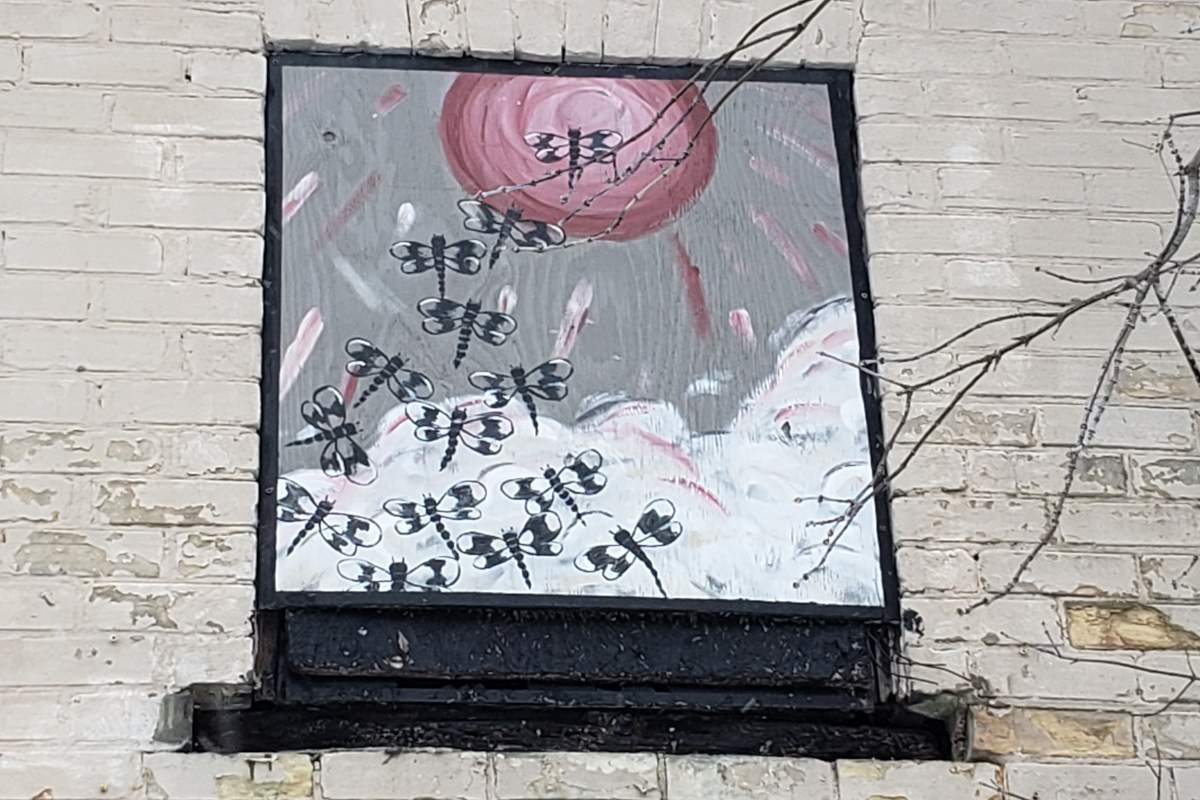 A beautification project by neighbours saw the windows covered with paintings.