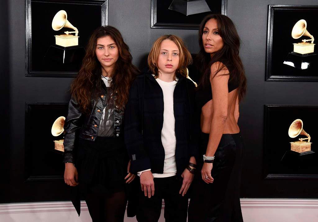 (L-R) Toni Cornell, Christopher Nicholas Cornell, and Vicky Karayiannis arrive at the 61st annual Grammy Awards at the Staples Center on Sunday, Feb. 10, 2019, in Los Angeles.