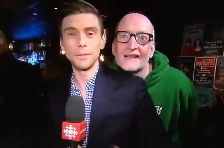 CBC reporter Chris Glover is harrassed by comedian Boyd Banks during a live newscast on Feb. 26, 2019.
