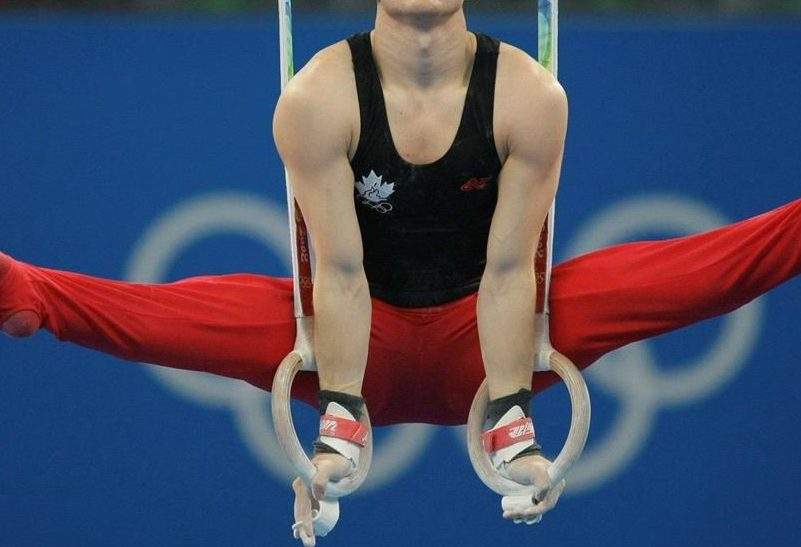 Canada’s gymnast Kyle Shewfelt performs at the rings during the men’s qualification rounds at the Beijing 2008 Olympics in Beijing, Saturday, Aug. 9, 2008.