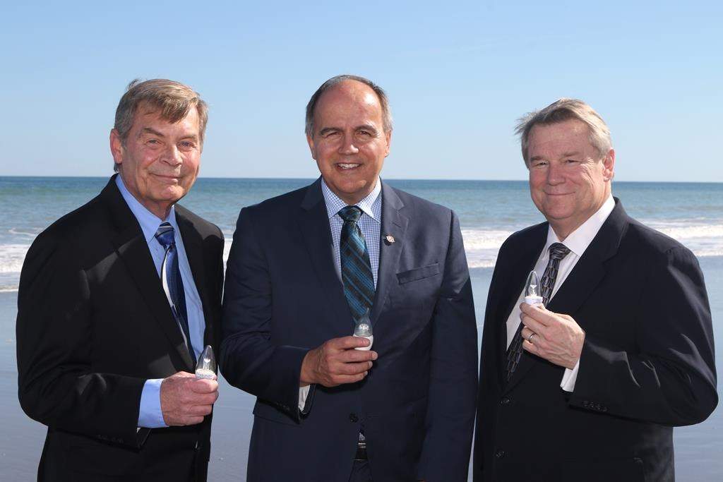 Rob Koeneman, co-founder, President and Senior VP Technology at Joi Scientific, left to right, Gaetan Thomas, CEO, NB Power and Traver Kennedy, CEO, Joi Scientific are seen in this undated handout photo.