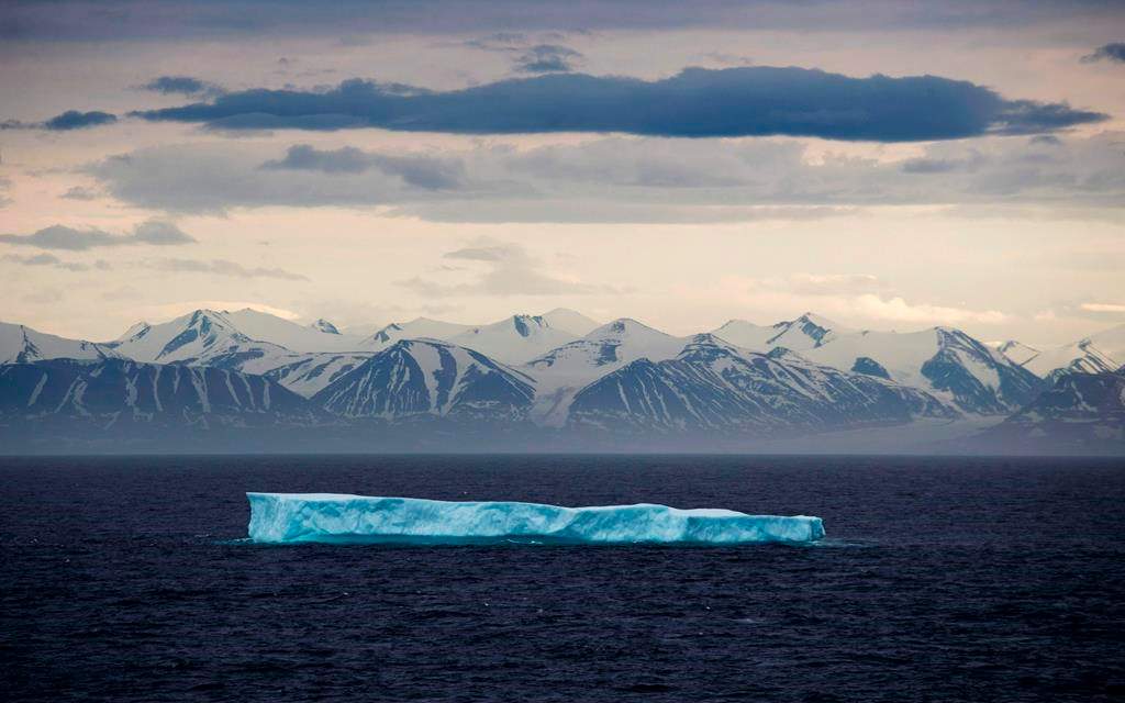 An iceberg floats past Bylot Island in the Canadian Arctic Archipelago, Monday, July 24, 2017. It's not your usual theft target: Iceberg water.But police say 30,000 litres has been stolen from a warehouse in Port Union, N.L.