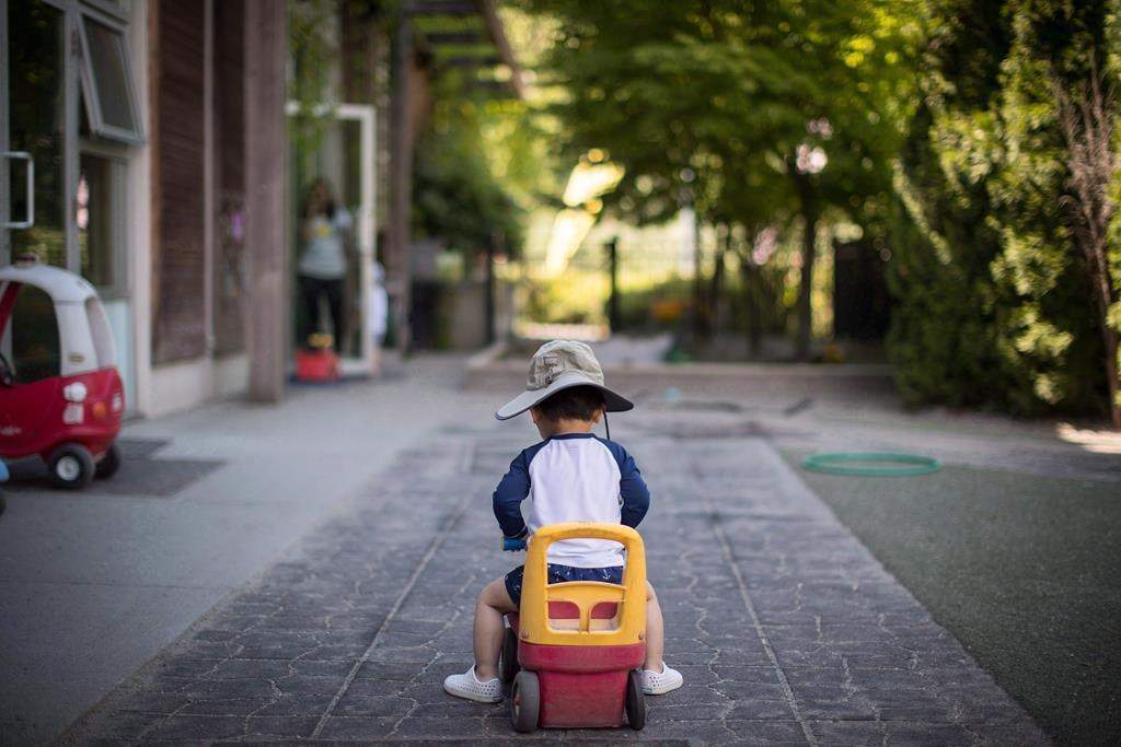 A young boy plays at a daycare in Langley, B.C., on Tuesday May 29, 2018. THE CANADIAN PRESS/Darryl Dyck