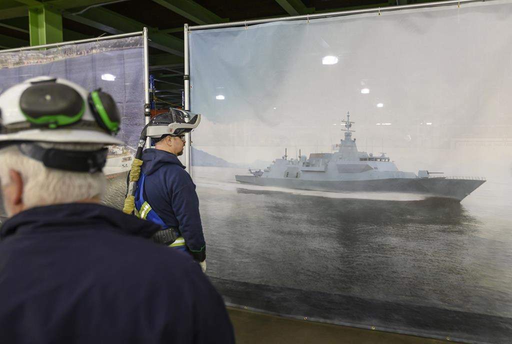Shipbuilders look at Lockheed Martin Canada's design of 15 new Canadian Surface Combatants to be built at Irving Shipbuilding's Halifax shipyard in Halifax on February 8, 2019.
