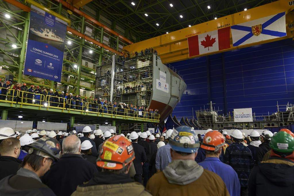 Shipbuilders and Irving employees attend the announcement of Lockheed Martin Canada as the designer of 15 new Canadian Surface Combatants to be built at Irving Shipbuilding's Halifax shipyard in Halifax on Friday, February 8, 2019. THE CANADIAN PRESS/Darren Calabrese.