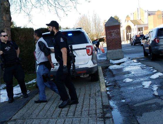 A man at the scene of Wednesday\’s stabbing outside Immaculate Conception Elementary School caught the moment the suspect was led away by officers.