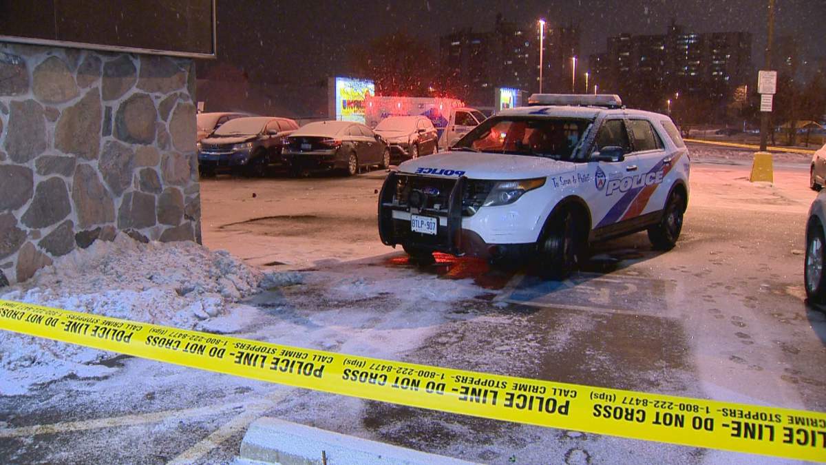 Police investigate a shooting at a plaza in Etobicoke on Feb. 10, 2019.