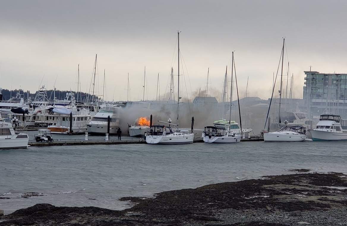 Firefighters work to extinguish a yacht fire in Sidney.
