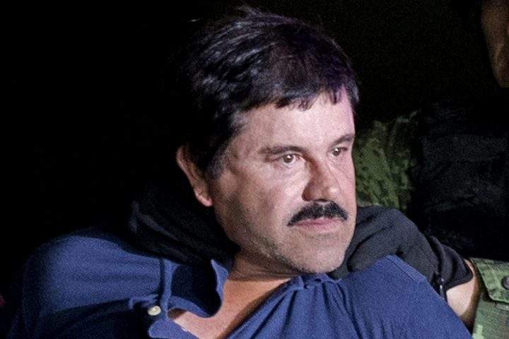In this Jan. 8, 2016 file photo, drug lord Joaquin “El Chapo” Guzman is made to face the media in Mexico City as he is escorted by Mexican soldiers following his recapture six months after escaping from a maximum security prison.