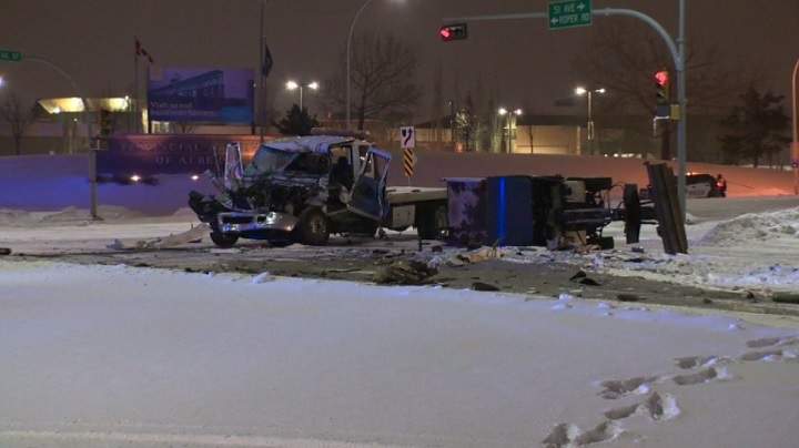 A crash between a large tow truck and a sand truck sends one man to hospital.