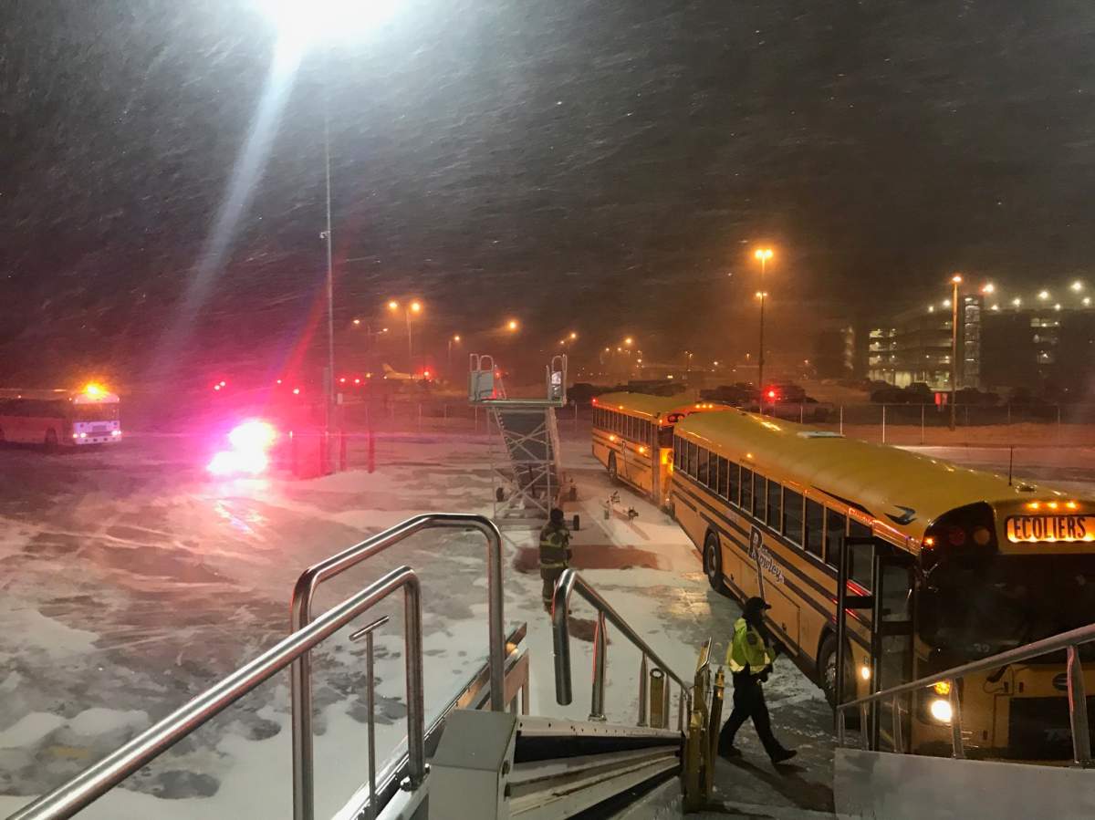 School buses had to be used to bring passengers from the plane to the terminal.