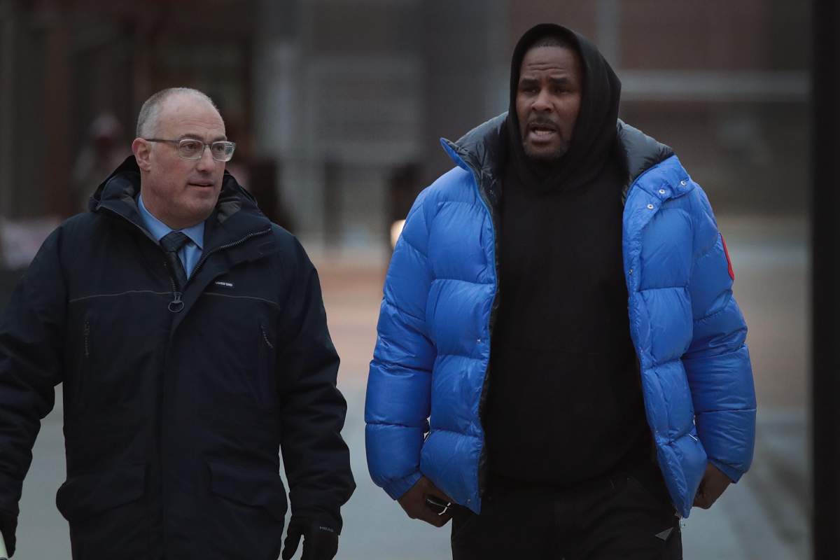R&B singer R. Kelly (R) and his attorney Steve Greenberg leave Cook County jail after Kelly posted $100 thousand bond on February 25, 2019 in Chicago, Illinois.  Kelly was being held after turning himself in to face ten counts of aggravated sexual abuse.  (Photo by ).