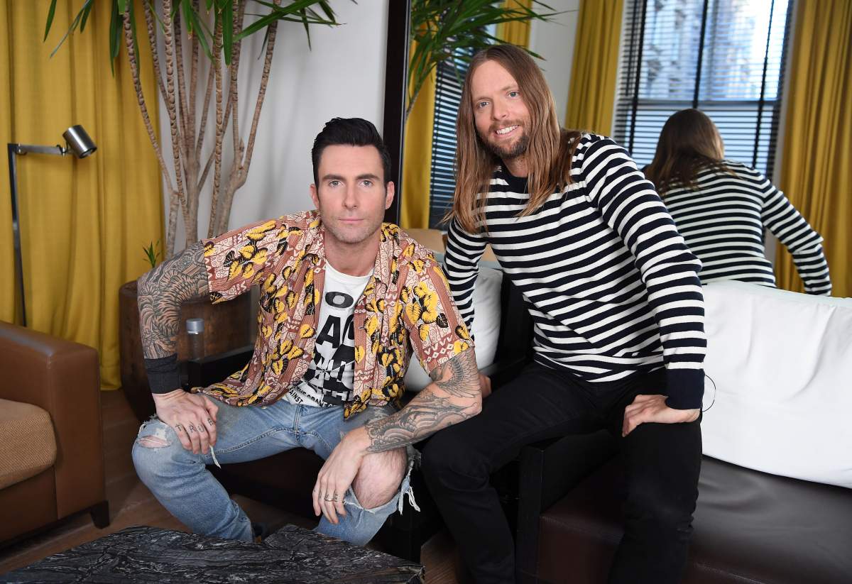 Adam Levine (L) and James Valentine of Maroon 5 pose for pictures in New York on Oct. 31, 2017.