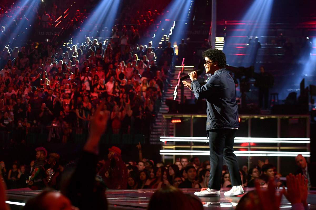 Bruno Mars speaks onstage at the 2018 Billboard Music Awards at MGM Grand Garden Arena on May 20, 2018, in Las Vegas, Nev.