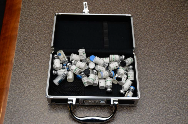 A container of bottles labelled HGH (human growth hormone) found by FBI agents who searched Christopher Hasson’s home.