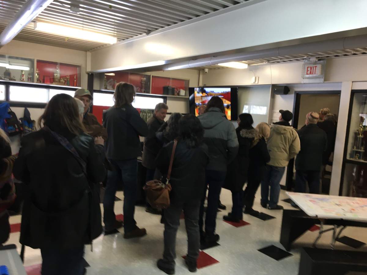 Over one hundred people in line at the Luxton Community centre, waiting to cast their vote.