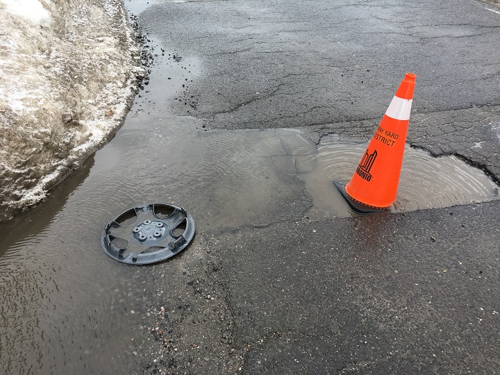 A pothole is seen on The Donway West in Toronto Thursday morning.