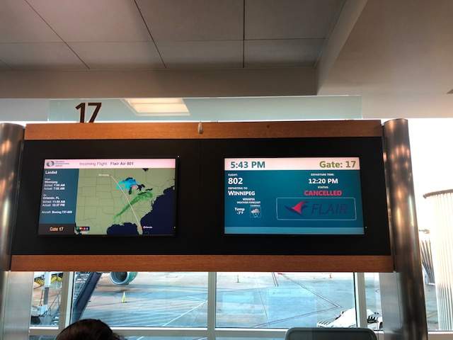A flight board at the Orlando Airport shows the cancelled Flair Air flight. John Ilag/Submitted